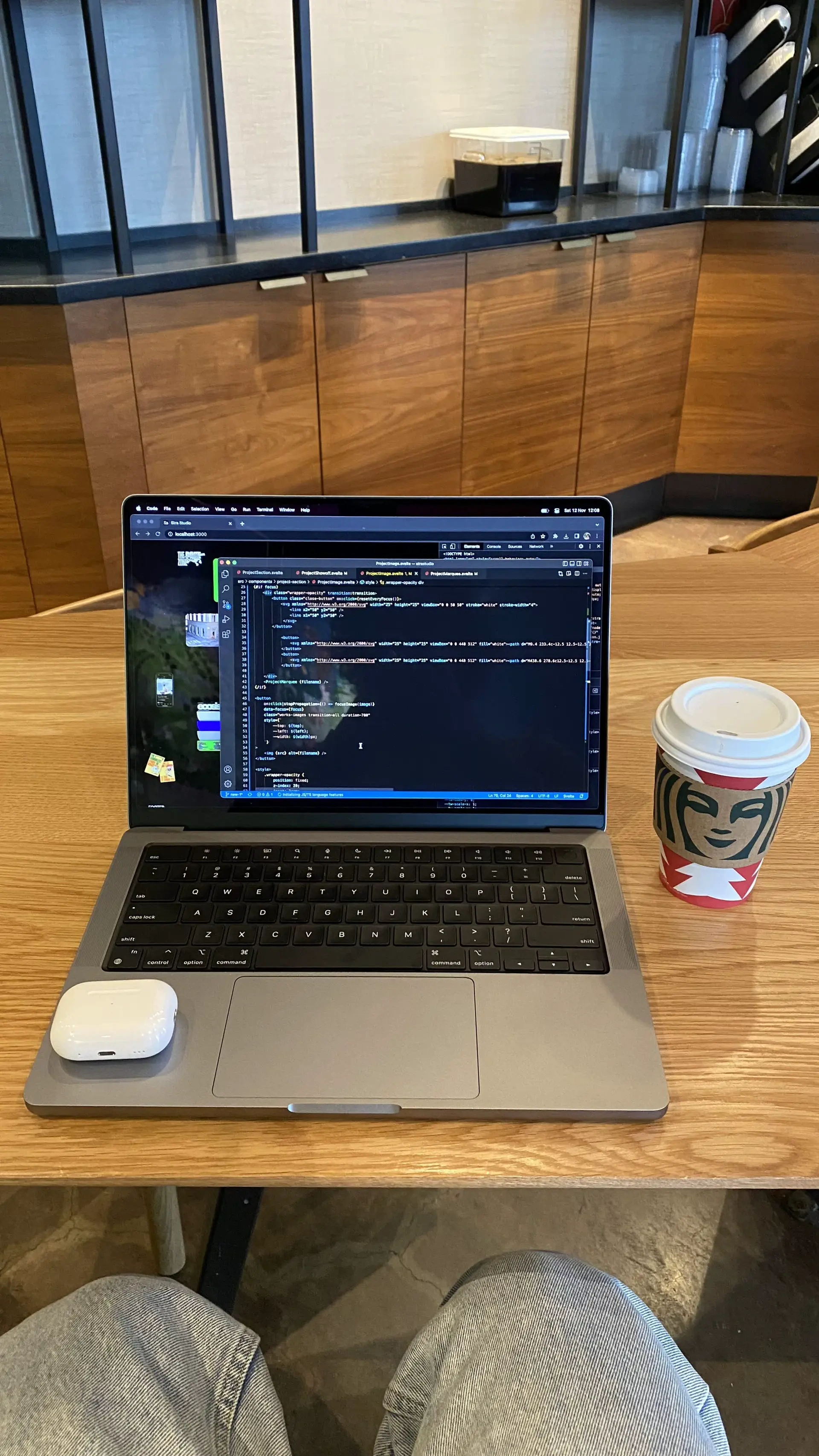 Laptop and coffee on a wooden table