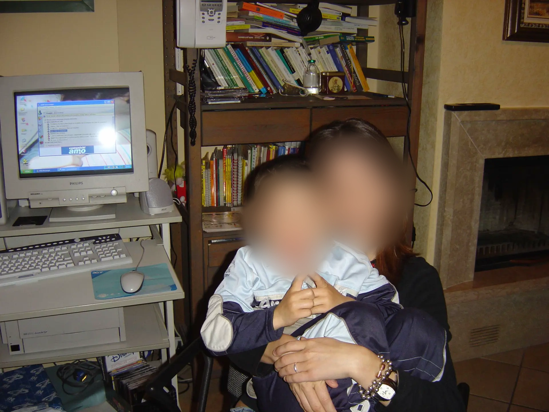 Childhood desktop computer beside a bookshelf