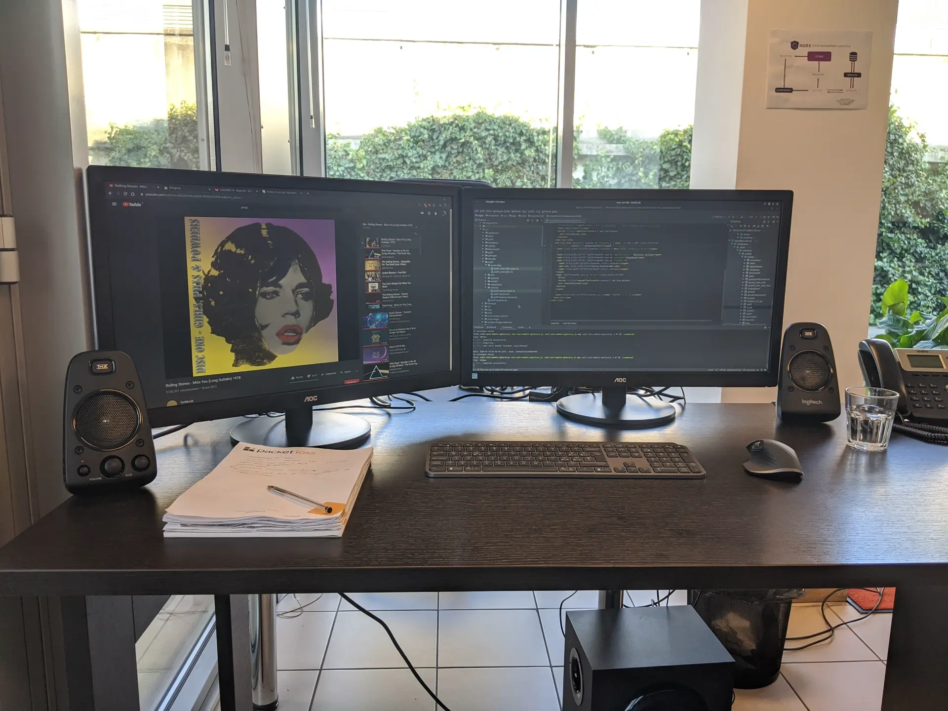 Dual-monitor workstation beside a bright window