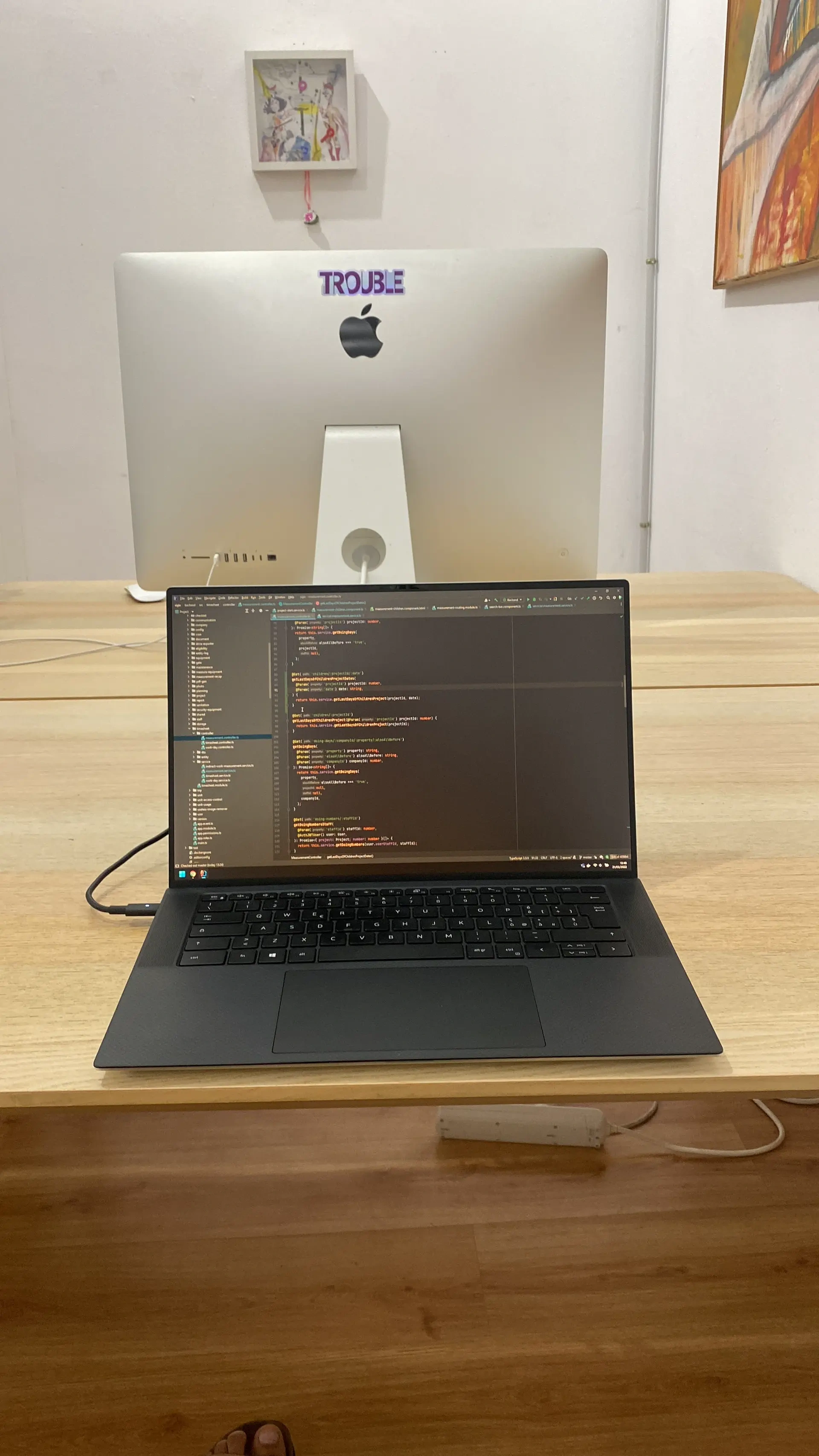 Laptop and iMac on a wooden desk